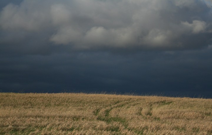 A storm approaching over a hay field (Photo credit: R. Fisher).